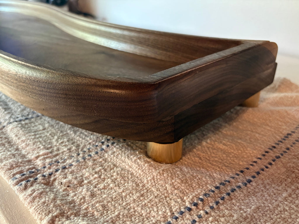 Close-up detail shot of The Solitude solid walnut tray edge and finish quality
