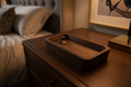 The Sanctum solid walnut ring and watch tray overhead view showing precision-routed compartments and hand-finished satin surface

